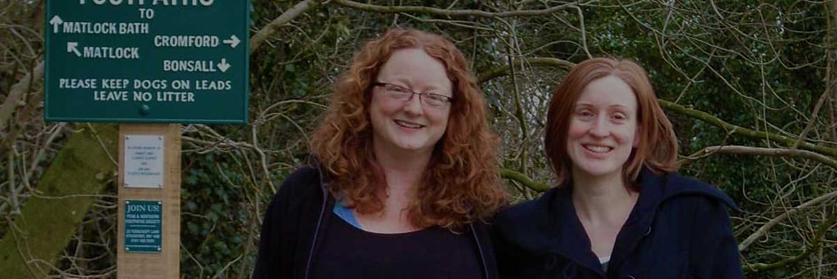 Two smiling student volunteers